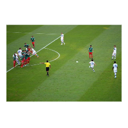 A soccer player scoring a goal